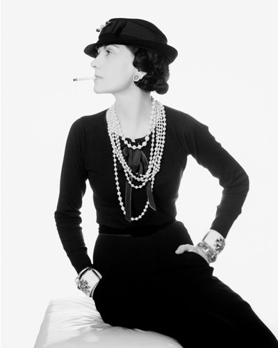 Portrait of Coco Chanel wearing her Maltese Cross Cuffs