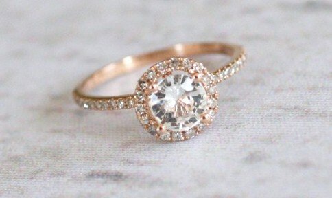 A white sapphire engagement ring