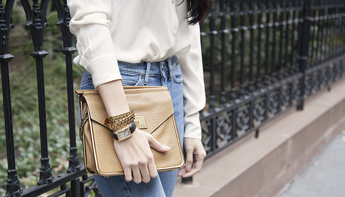 Cartier watch and brown handbag