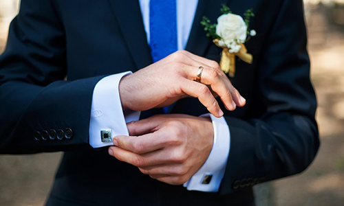 Groom wearing wedding band