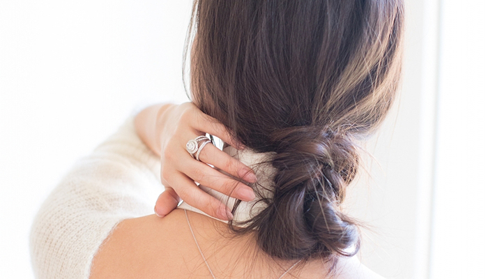 Blogger Peony Lim modeling engagement rings by Jenny Packham