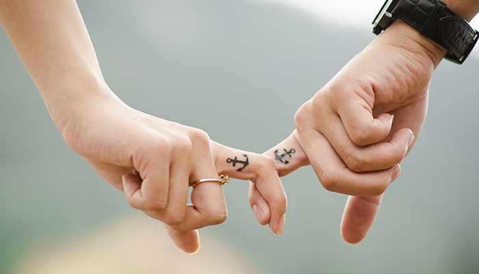 Newlywed couple with anchor bridal tattoos