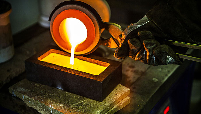 Melted gold being poured into a mold