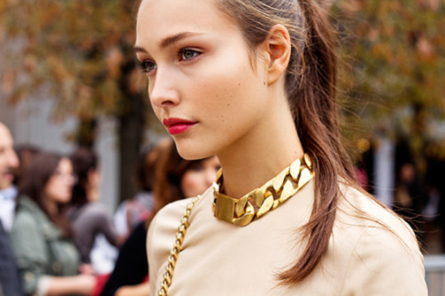 Fashion Week model wearing a gold thick chain necklace 