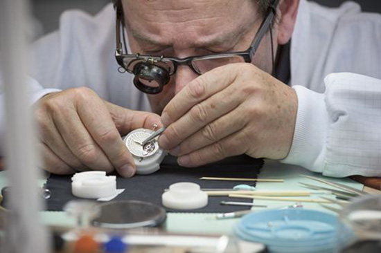 A watchmaker carefully assembling a Girard Perregaux luxury watch (Image courtesy of Girard Perregaux)