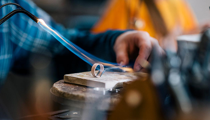 Jeweler resizing a ring. Image courtesy of Bankrate.