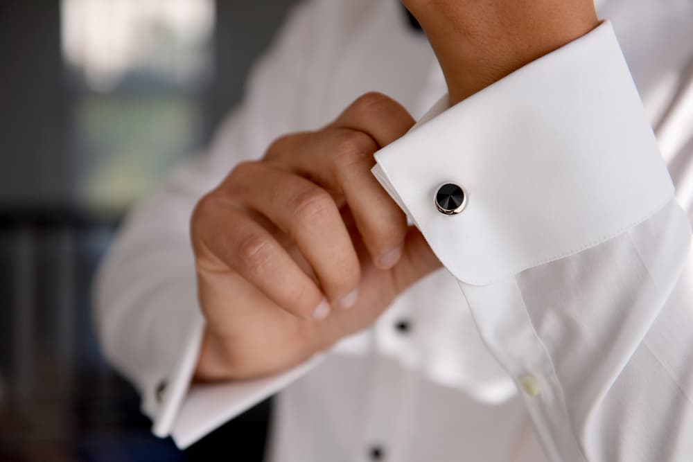 wearing cufflinks