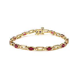 10K Yellow Gold Oval Ruby and 1/10 Cttw Diamond Bar Prong Set Bracelet (H-I Color, SI1-SI2 Clarity) - Size 7"