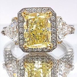 Fancy Yellow Cushion Diamond 4.91 tcw Three Stone Engagement Ring 18kt WG YG