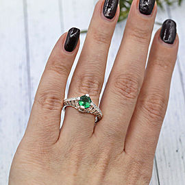 Platinum Fashion ring features Round cut Green Emerald and 0.80ct TCW Diamonds