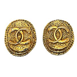 CHANEL - Vintage 1970's CC Textured Oval Medallion Clip-On / Gold-tone Earrings