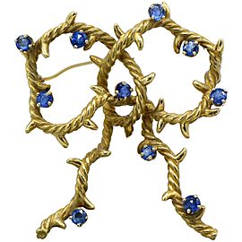 Cartier, New York 18 Karat Gold and Sapphire Bow Shaped Brooch