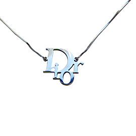 Shipping For: Christian Dior Silvertone "DIOR" Pendant Necklace